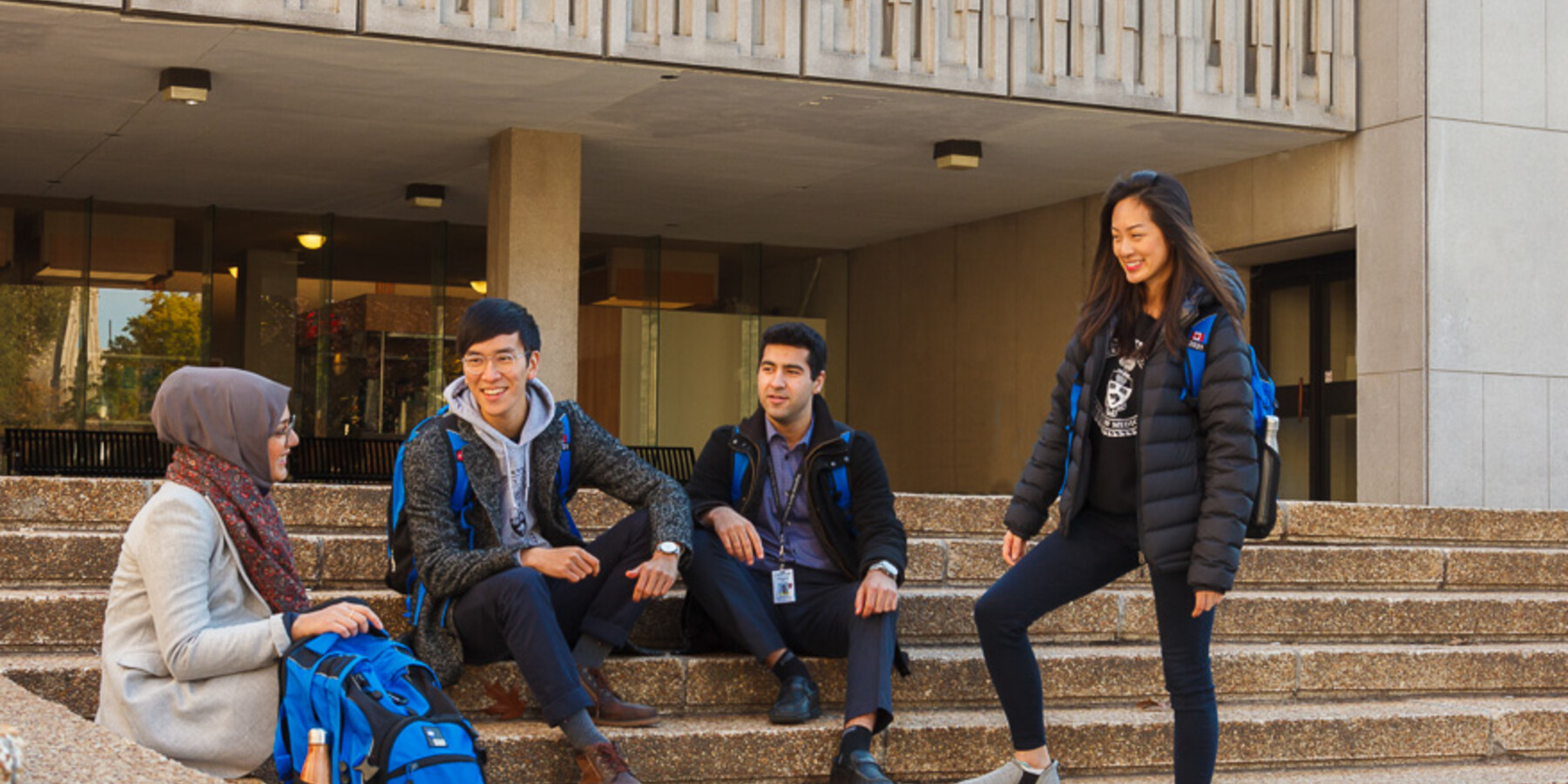 Students talk outside the Medical Sciences Building. 