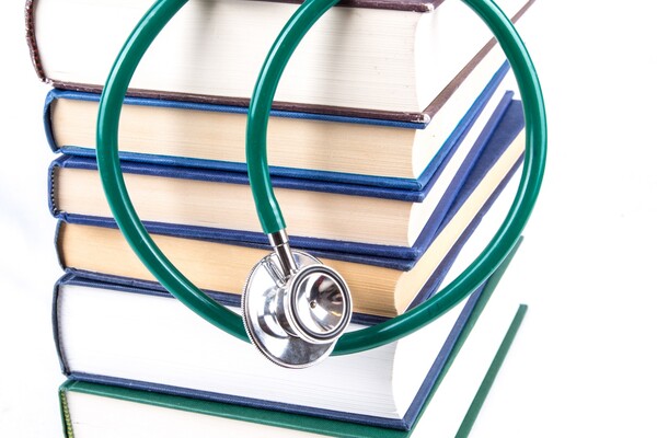 Books and stethoscope.