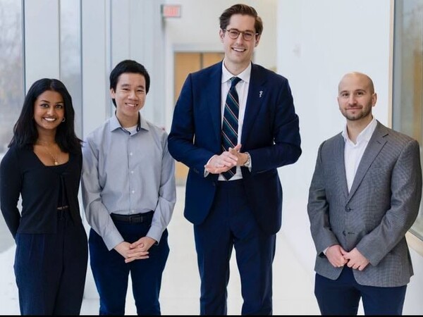A smiling group of people standing together