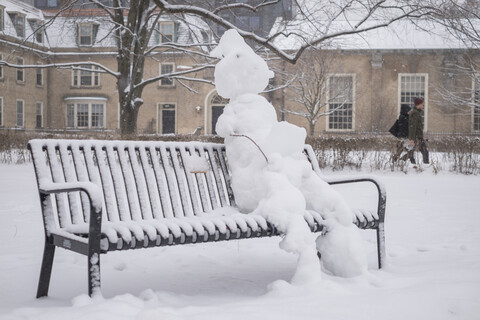 Snowman on a Bench on Campus