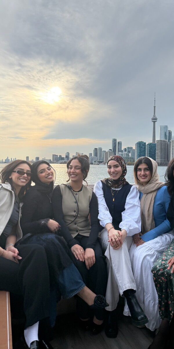 A group of women sitting on a boat